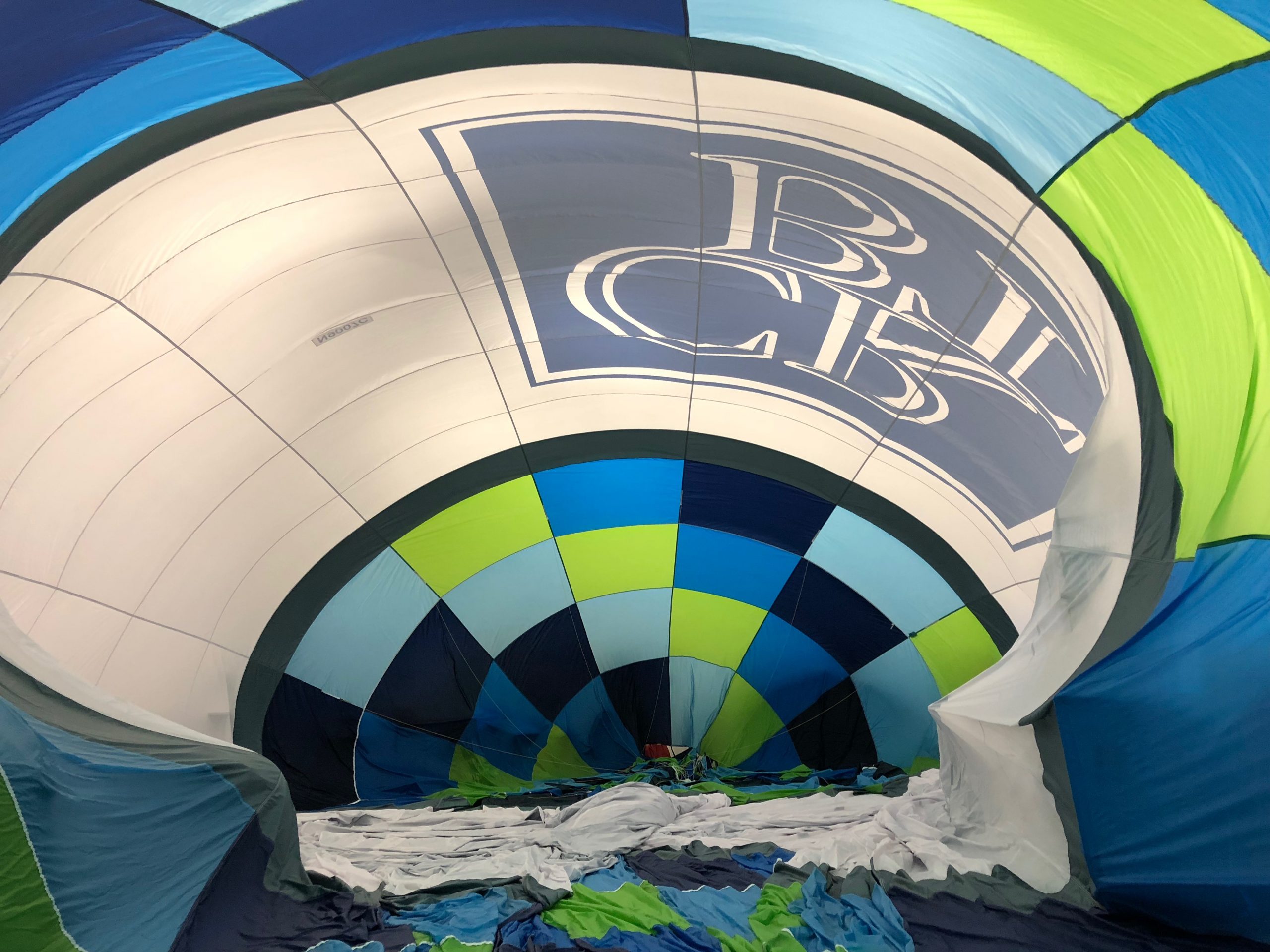 Inside the partially inflated Cedar Rapids Bank & Trust balloon during rigging at the Lindstrand factory